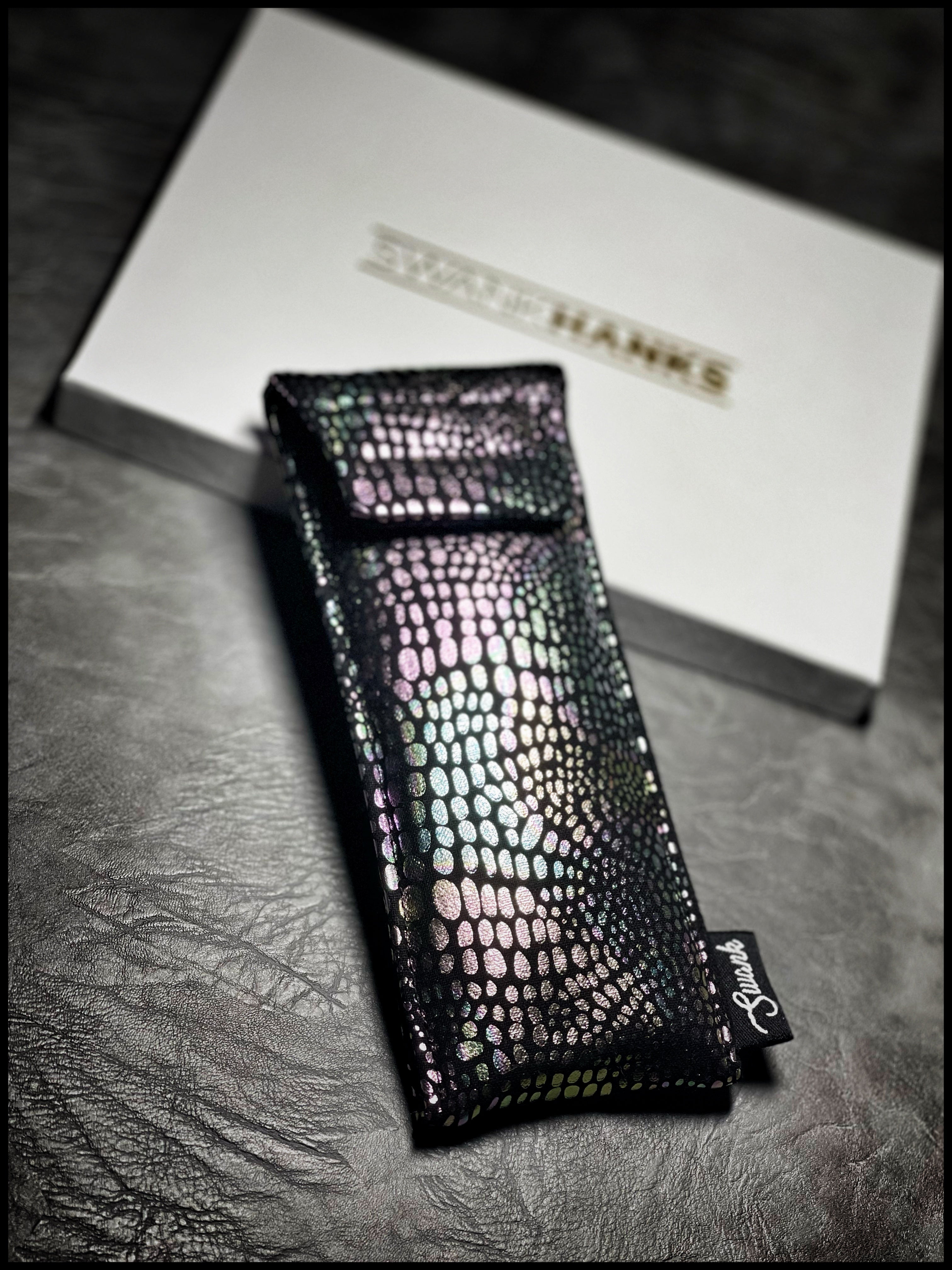 Raptor scale neon pouch